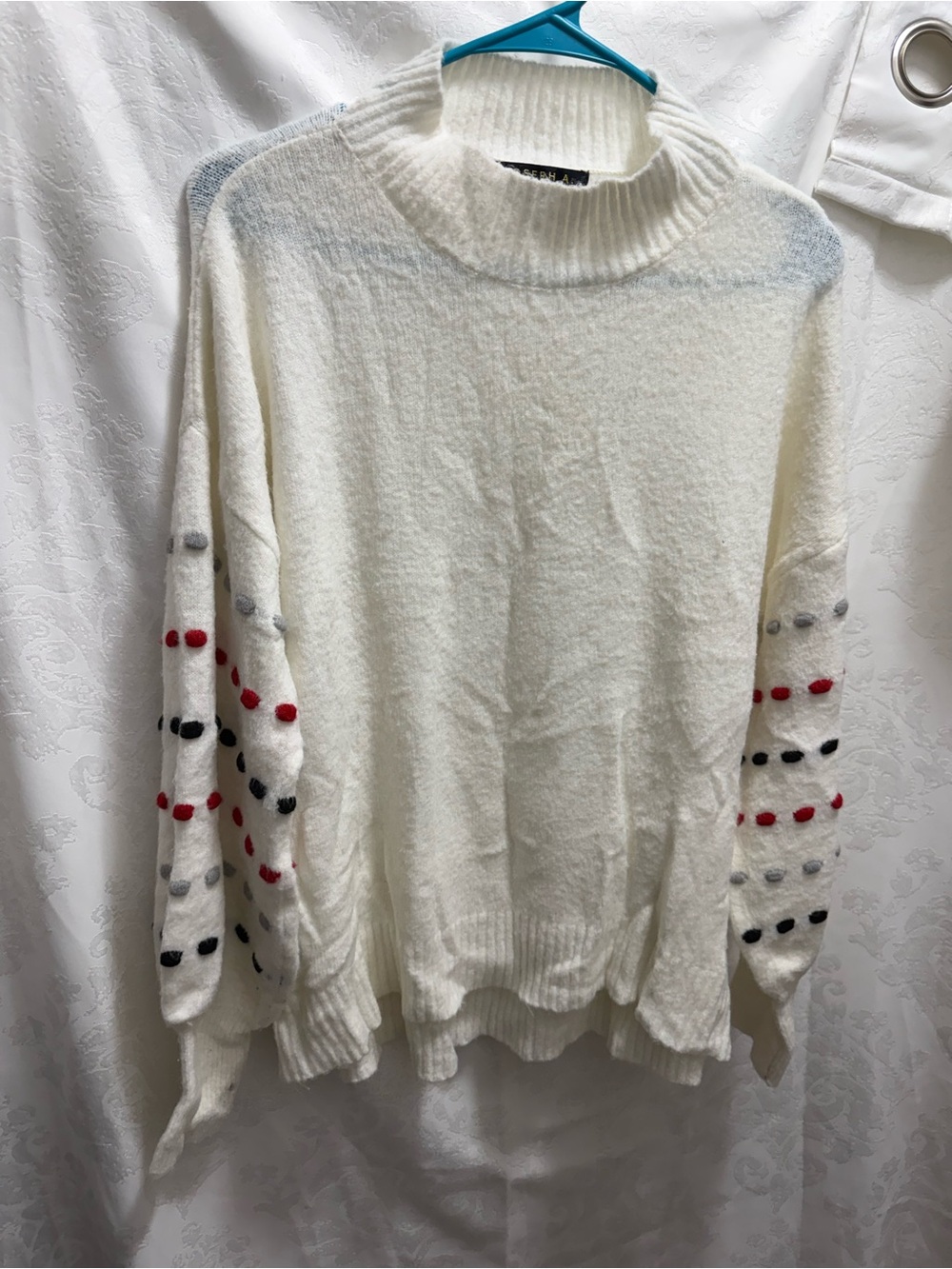Joseph A Cream Mock Neck Sweater with Red, Black, and Gray Sleeve Dots